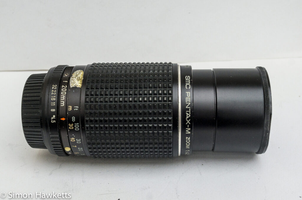 pentax m smc 80 200mm f 4 5 zoom lens with lens hood collapsed