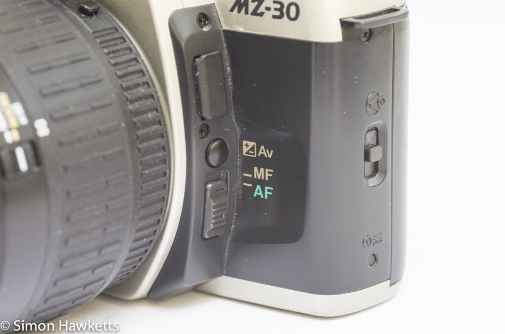 Pentax MZ-30 35mm Autofocus slr showing Auto/Manual focus switch and exposure compensation