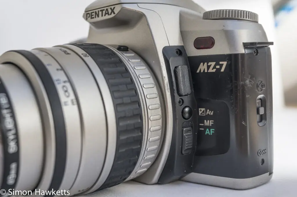 Pentax MZ-7 35mm autofocus slr showing auto/manual focus selector and exposure compensation button
