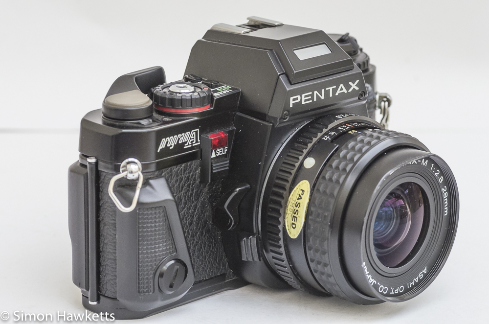 pentax program a 35mm slr side view showing self timer depth of field preview and lens release