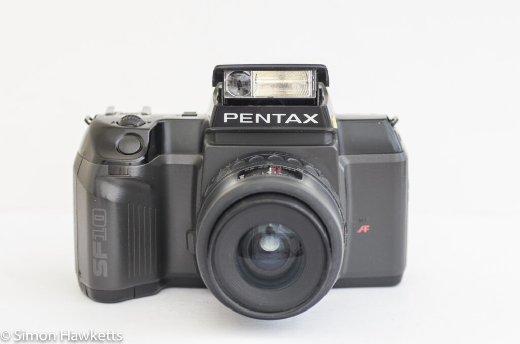 Pentax SF10 35mm slr showing the flash up and the focus assist light