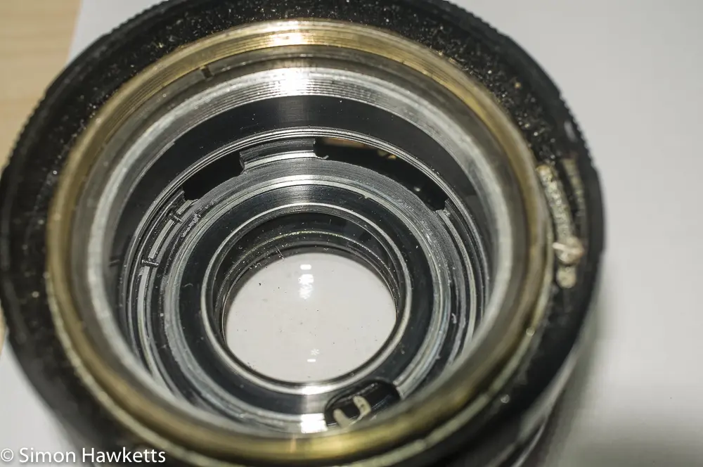 Petri 55mm f/2 CC lens showing bottom of lens and actuation lever (at bottom)