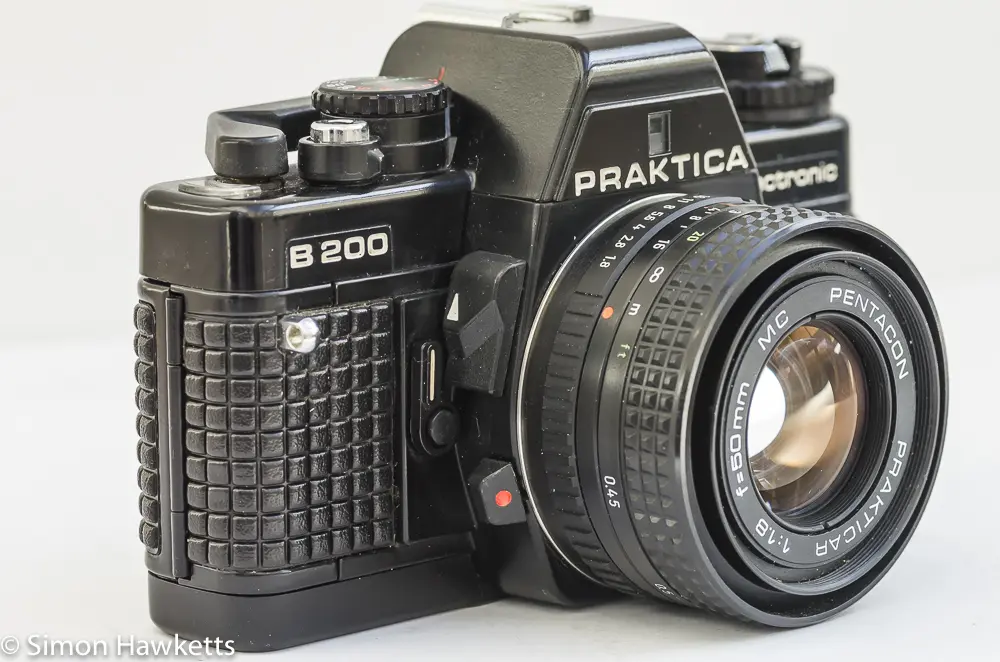 Praktica B200 side view showing self timer, depth of field preview and lens release