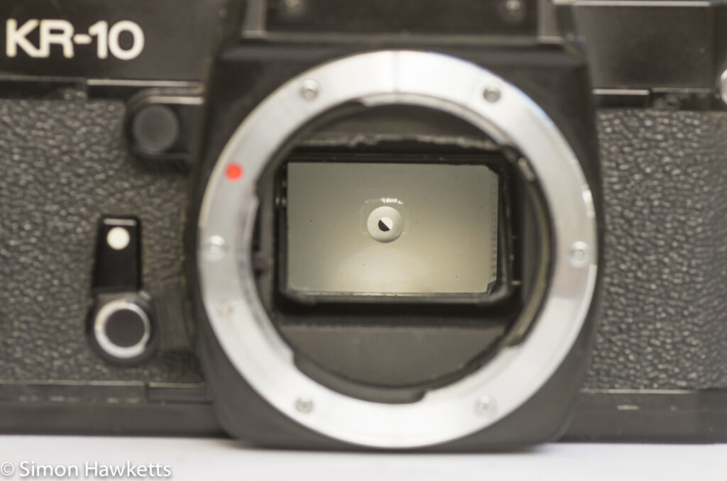 Ricoh KR-10 35mm SLR showing diagonal split rangefinder in focus screen