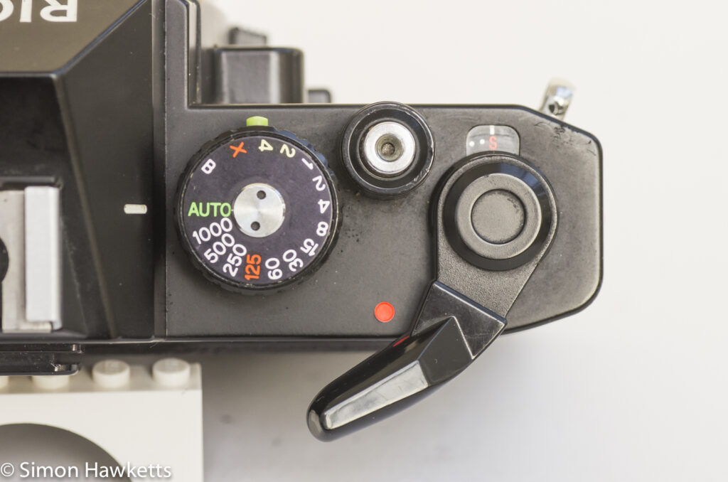 Ricoh KR-10 35mm SLR showing on/off switch integrated into film advance