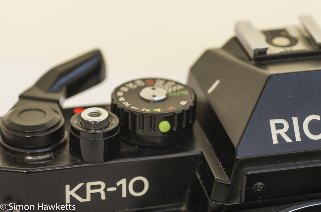 Ricoh KR-10 35mm SLR showing shutter speed lock button