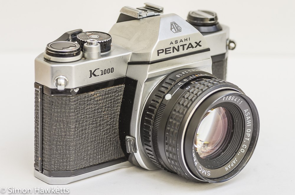 side view of the pentax k1000 showing the lens mount release