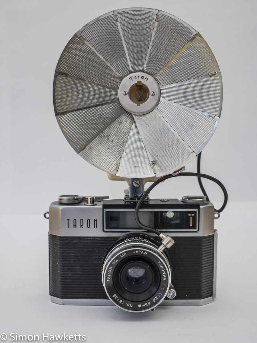 Taron Unique 35mm rangefinder camera with flash unit fitted