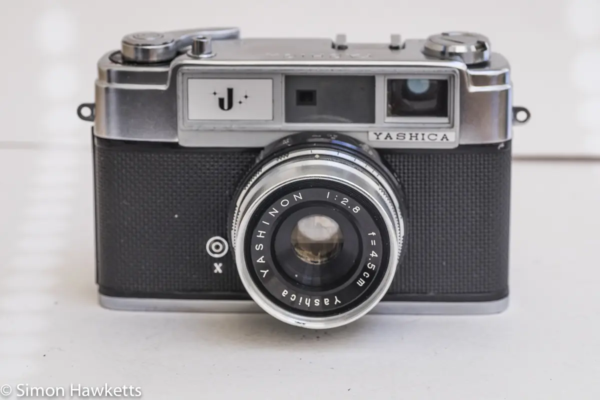 Yashica J 35mm rangefinder camera front view showing Yashinon 45mm f/2.8 lens