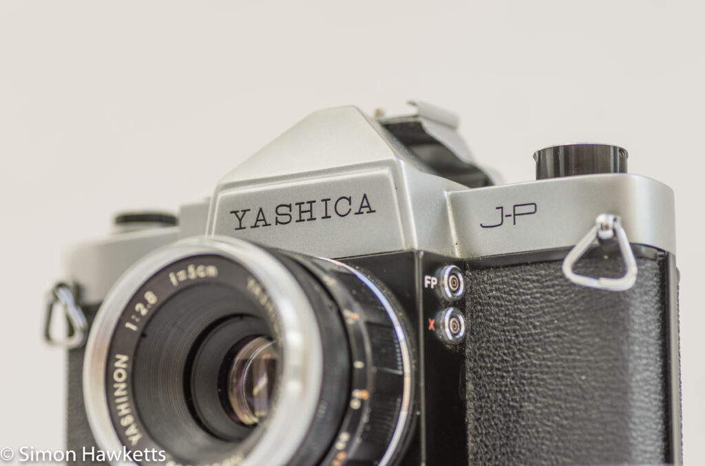 yashica j p 35mm slr camera front view showing sync sockets