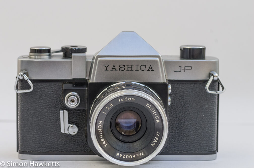 yashica j p 35mm slr camera front view with yashinon 5cm f 2 8 lens