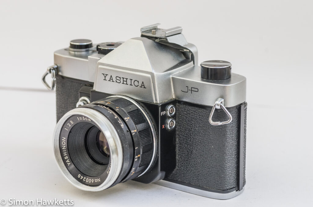 yashica j p 35mm slr camera side view showing the flash sync sockets