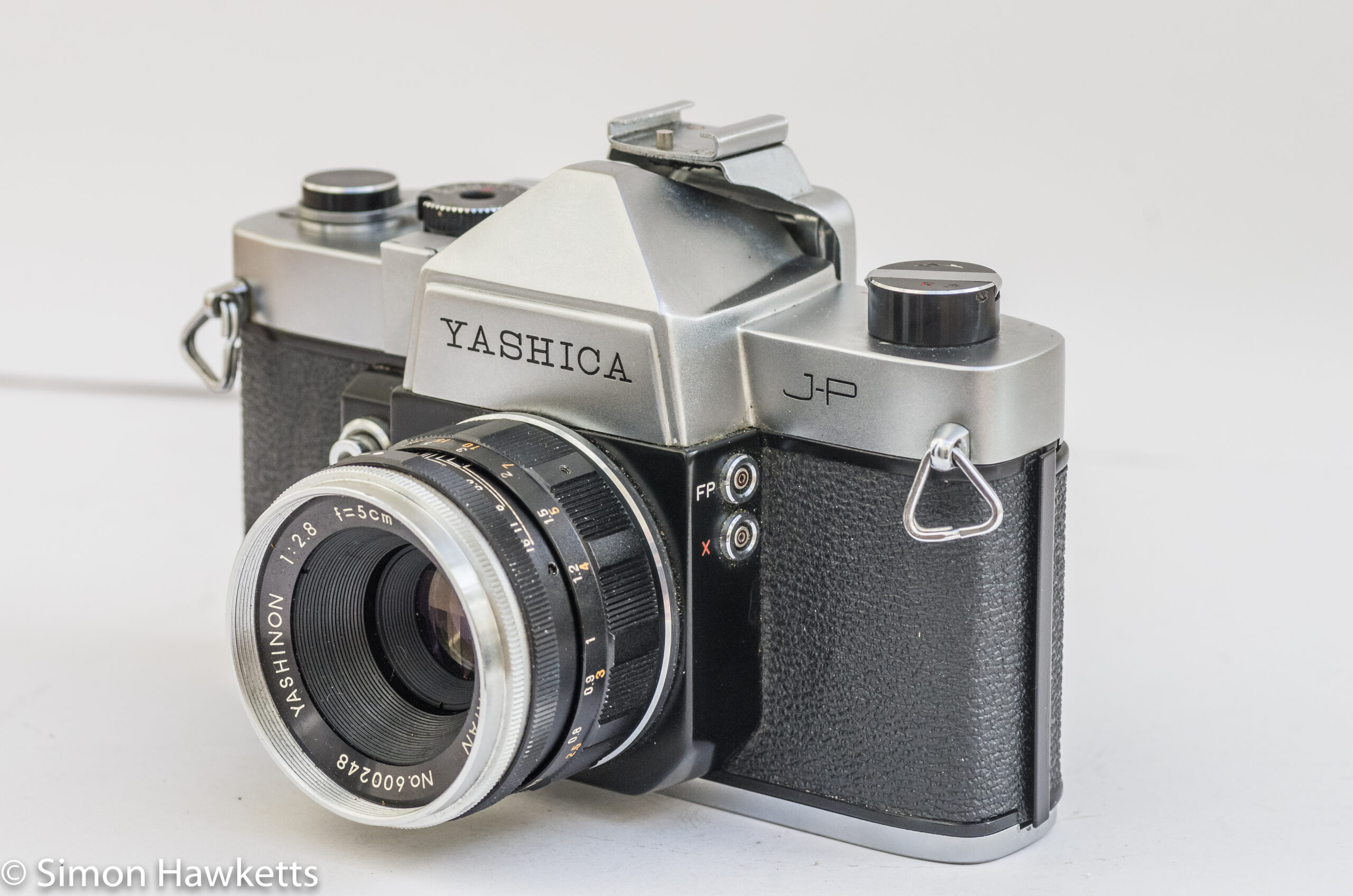Yashica J-P 35mm slr camera - side view showing the flash sync sockets