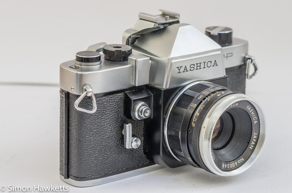 yashica j p 35mm slr camera side view showing the shutter release self timer and exposure meter slot