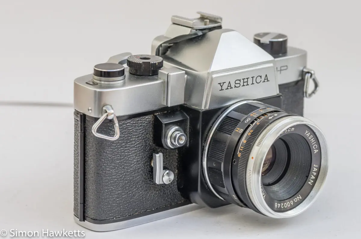 Yashica J-P 35mm slr camera - side view showing the shutter release, self timer and exposure meter slot