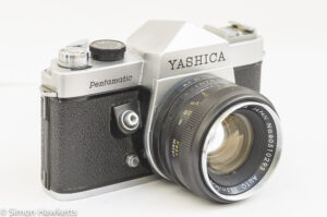 Yashica Pentamatic 35mm slr side view showing lens release and shutter button