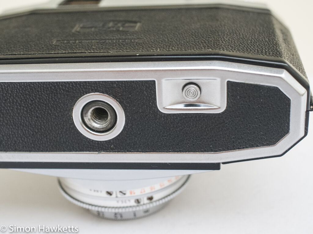 Zeiss Ikon Contina 35mm viewfinder camera showing rewind button and tripod bush