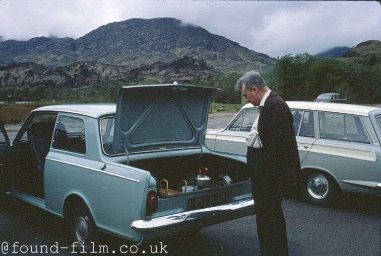 Man looking into the boot of his car