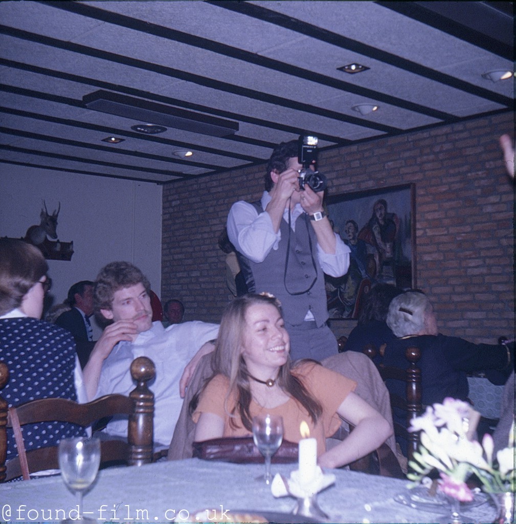 Man taking a photo at a wedding - c 1975