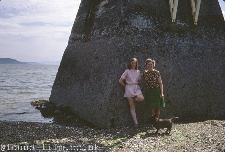 Two women on a beach with a dog - June 1971