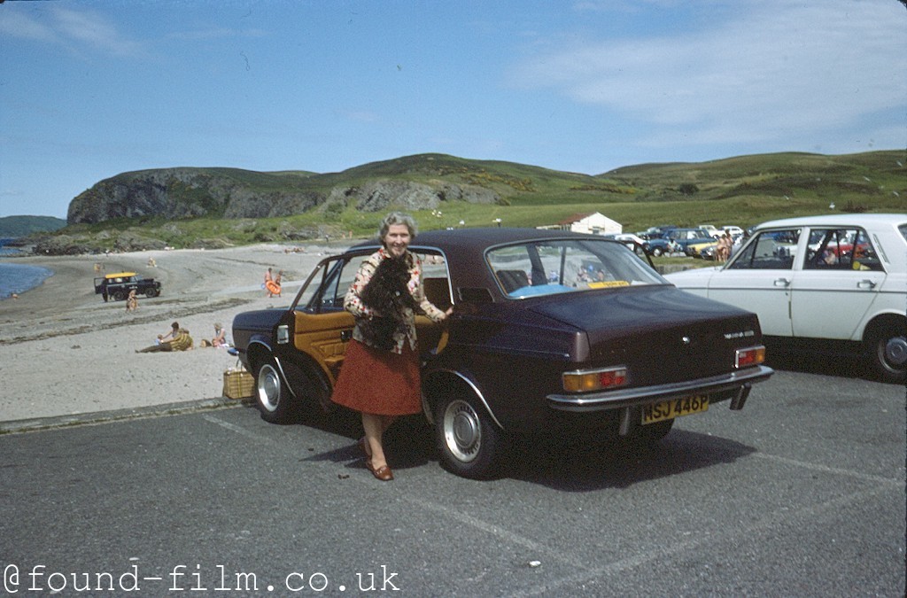 Woman and dog emerging from a car - Jun 1977