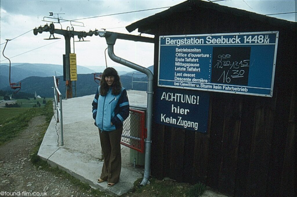 A woman standing by the Seebuck ski lift