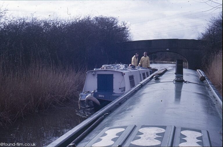 a narrow boat passing another narrow boat